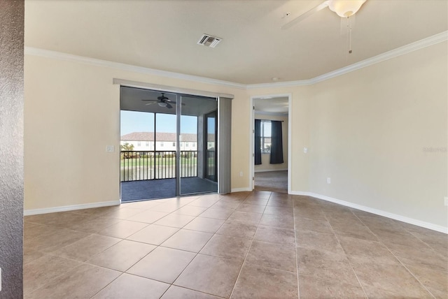 unfurnished room with ornamental molding and light tile patterned flooring