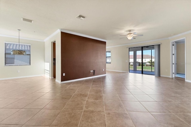 empty room featuring ceiling fan, crown molding, and light tile patterned floors