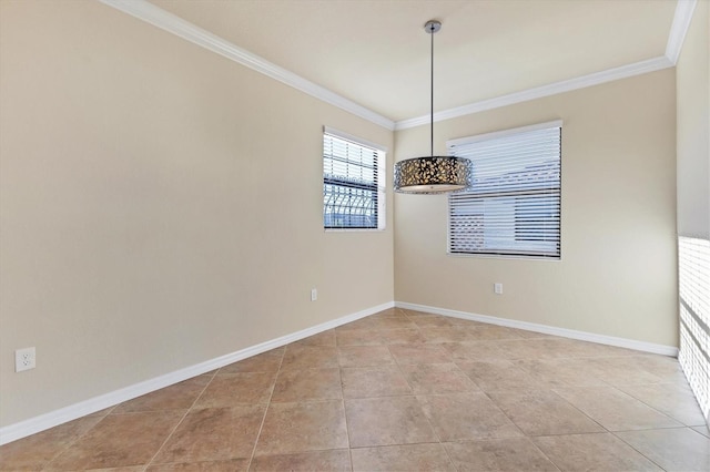 spare room with light tile patterned floors and ornamental molding