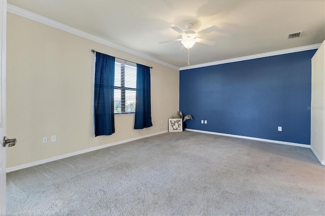 unfurnished room featuring ceiling fan, ornamental molding, and light carpet