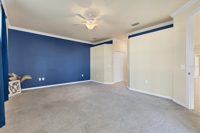 unfurnished bedroom with carpet, a closet, ceiling fan, and crown molding