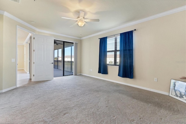 carpeted empty room featuring ceiling fan and ornamental molding