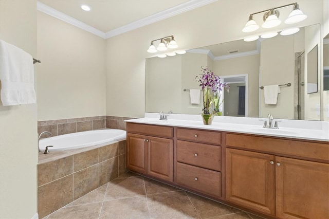 bathroom with tile patterned floors, tiled bath, vanity, and ornamental molding