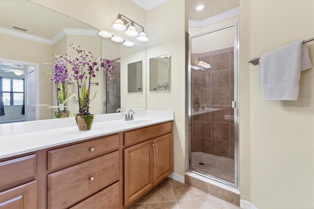 bathroom with crown molding, tile patterned flooring, vanity, and an enclosed shower