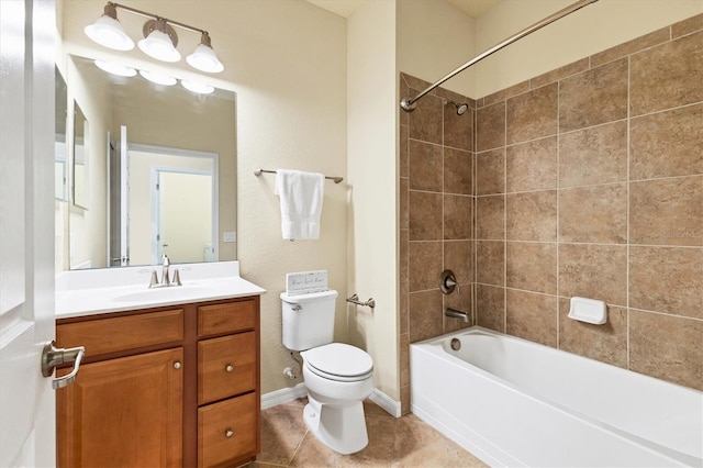 full bathroom featuring tile patterned floors, vanity, toilet, and tiled shower / bath