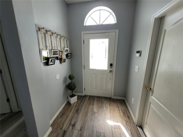 entryway with hardwood / wood-style floors