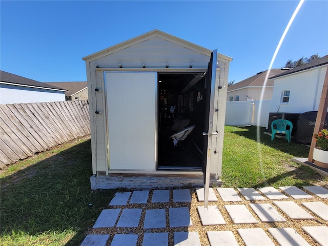 view of outdoor structure with a yard