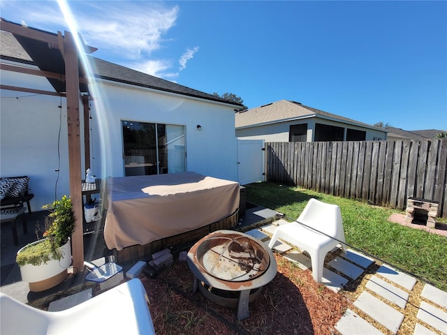 view of patio with an outdoor fire pit