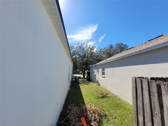 view of side of property featuring a yard