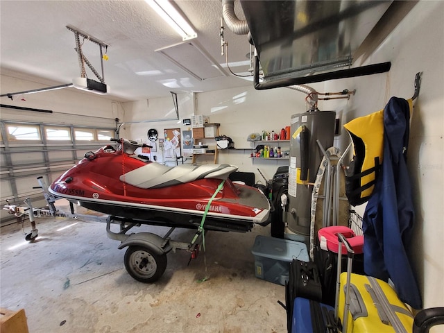 garage featuring a garage door opener and water heater