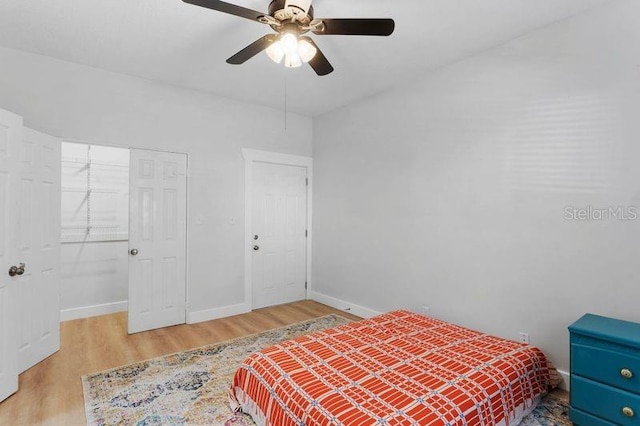 bedroom with light hardwood / wood-style flooring and ceiling fan