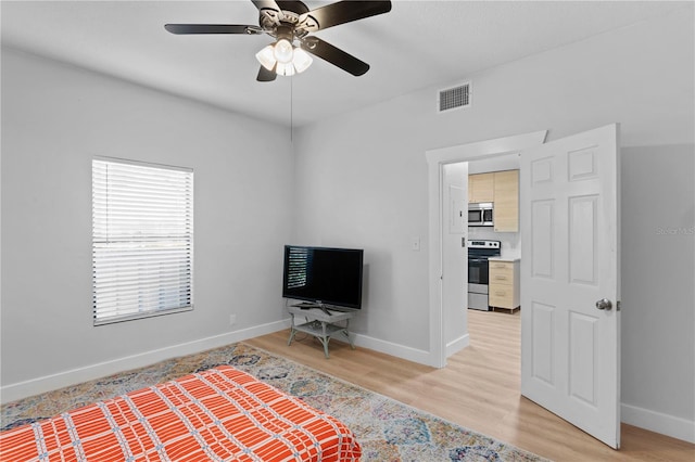 unfurnished bedroom featuring light hardwood / wood-style floors and ceiling fan