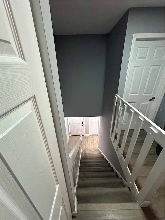 stairway featuring hardwood / wood-style flooring