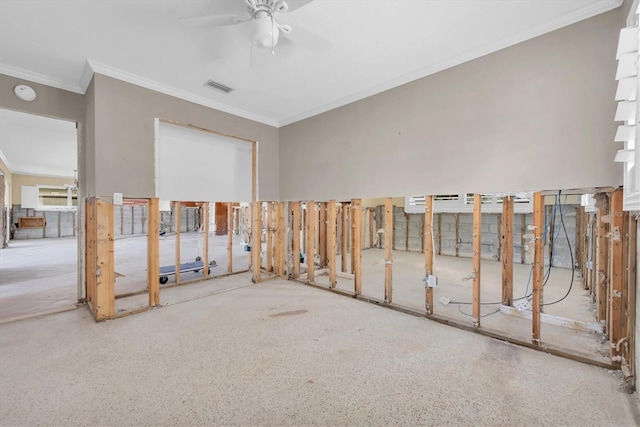 unfurnished room featuring ceiling fan and ornamental molding