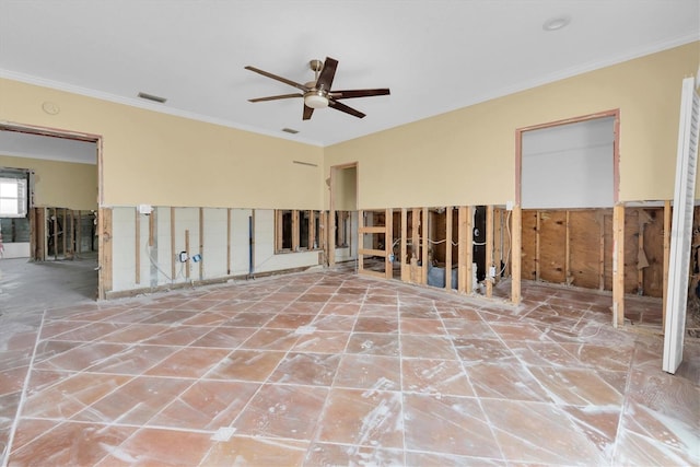 unfurnished room with ceiling fan and crown molding