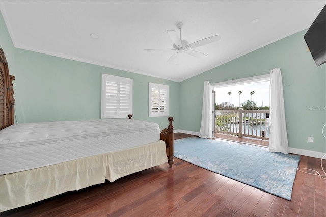 bedroom with access to exterior, ceiling fan, dark wood-type flooring, a water view, and lofted ceiling