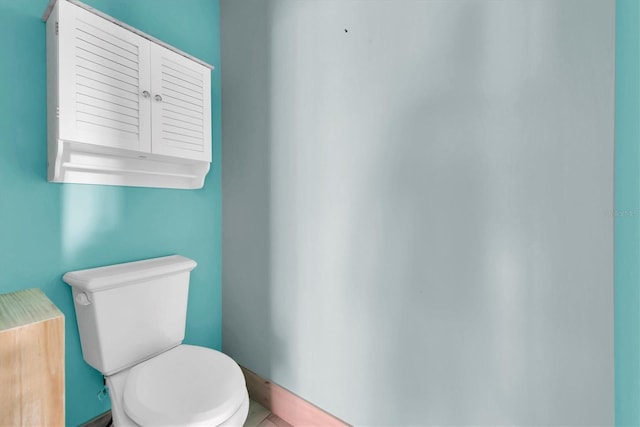 bathroom featuring tile patterned floors and toilet