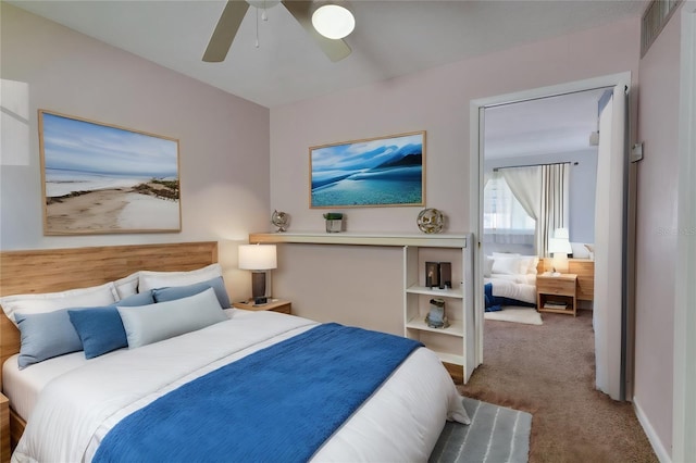 carpeted bedroom featuring ceiling fan