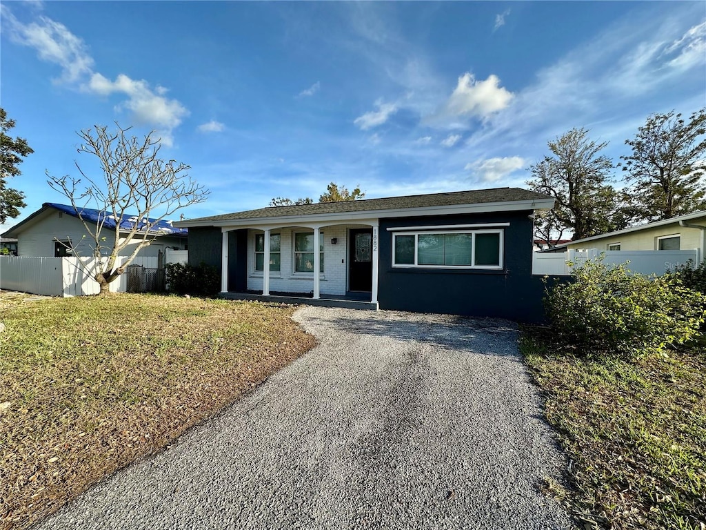 ranch-style house with a front lawn