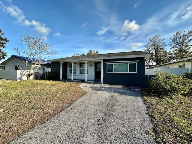 ranch-style house with a front lawn