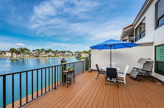 wooden deck featuring a water view