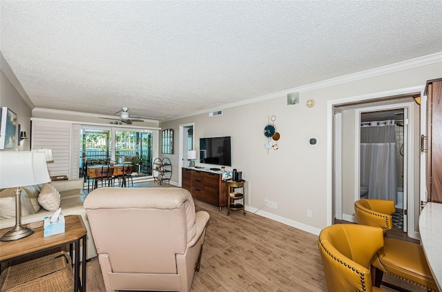 living room with crown molding, a textured ceiling, light hardwood / wood-style flooring, and ceiling fan