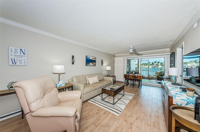 living room featuring ceiling fan, crown molding, a textured ceiling, and light hardwood / wood-style flooring