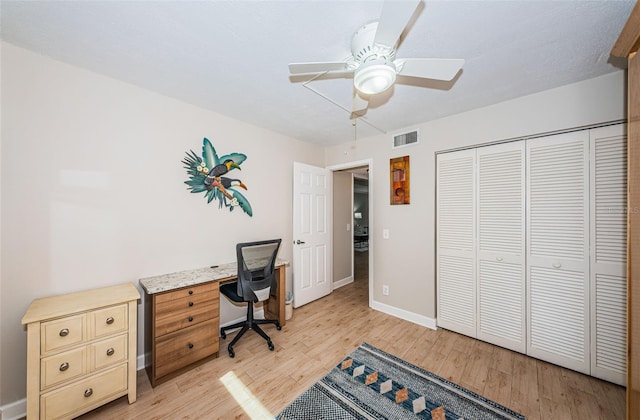 office area with light hardwood / wood-style floors and ceiling fan