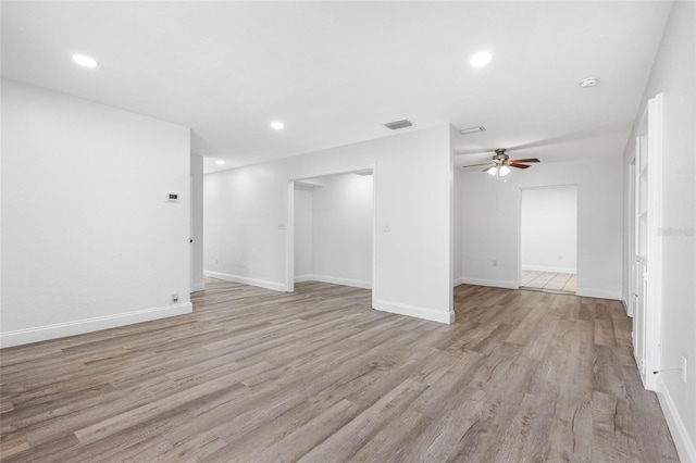 unfurnished living room featuring light hardwood / wood-style floors and ceiling fan