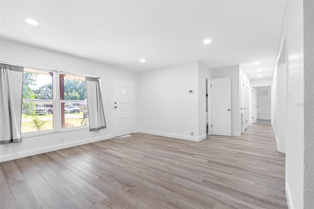 unfurnished room featuring light hardwood / wood-style floors