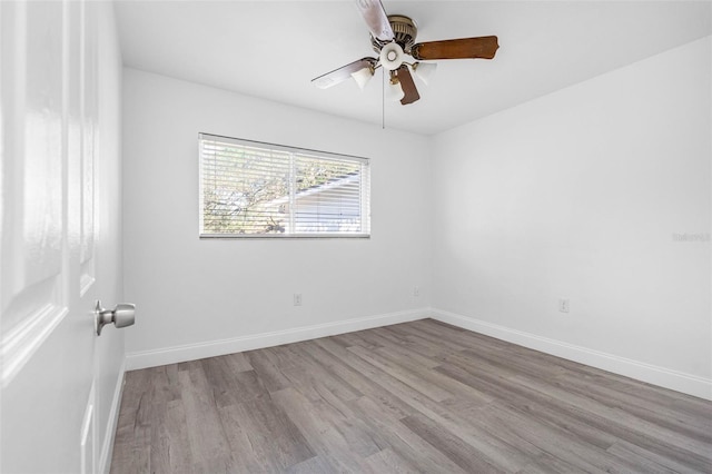 unfurnished room featuring light hardwood / wood-style floors and ceiling fan