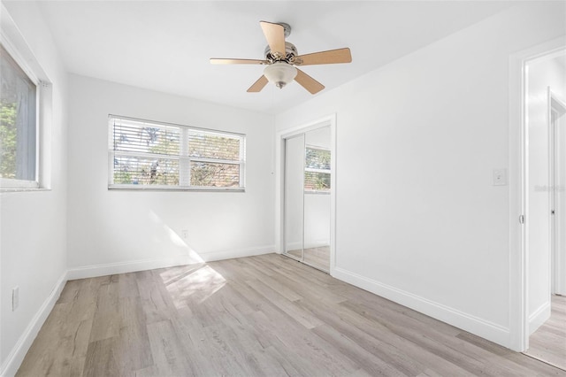 spare room featuring light hardwood / wood-style floors and ceiling fan