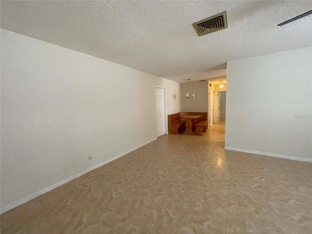 empty room with a textured ceiling