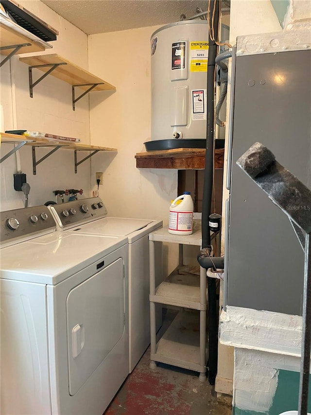 laundry room featuring water heater and separate washer and dryer