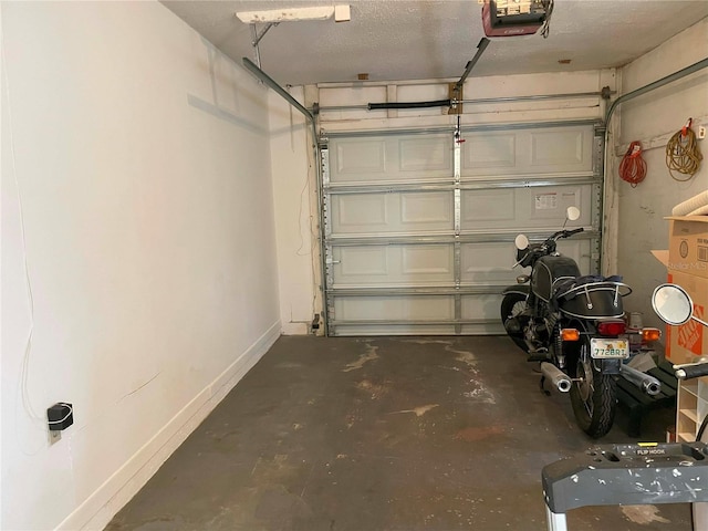 garage featuring a garage door opener