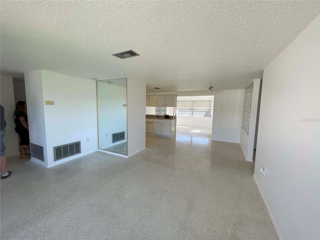 empty room with a textured ceiling