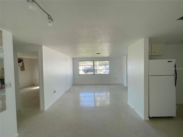 interior space with a textured ceiling