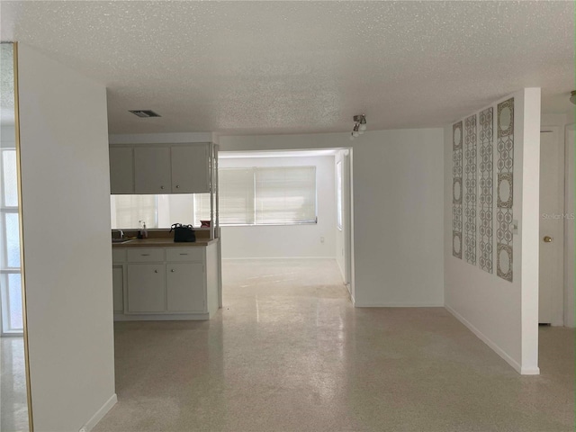 interior space featuring a textured ceiling