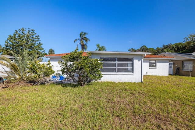 back of house with a yard