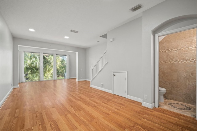 unfurnished living room featuring light hardwood / wood-style flooring