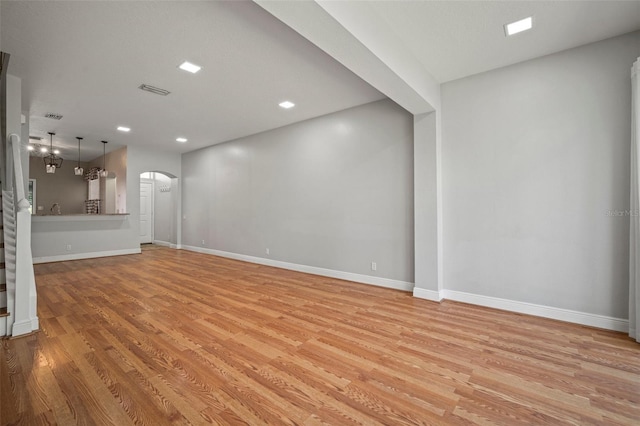 unfurnished living room featuring light hardwood / wood-style floors