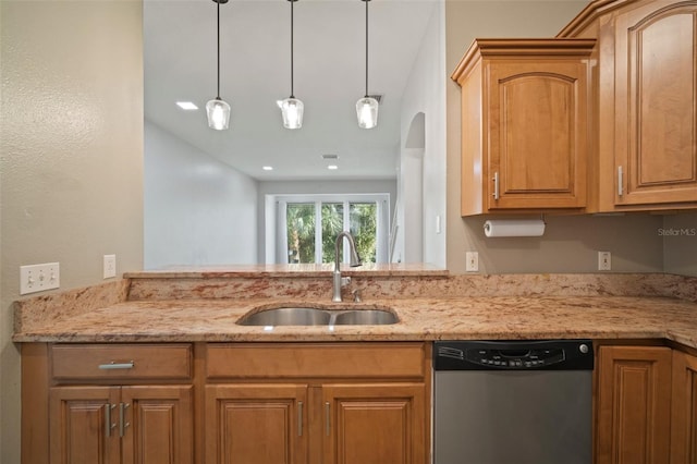 kitchen featuring decorative light fixtures, light stone countertops, stainless steel dishwasher, and sink