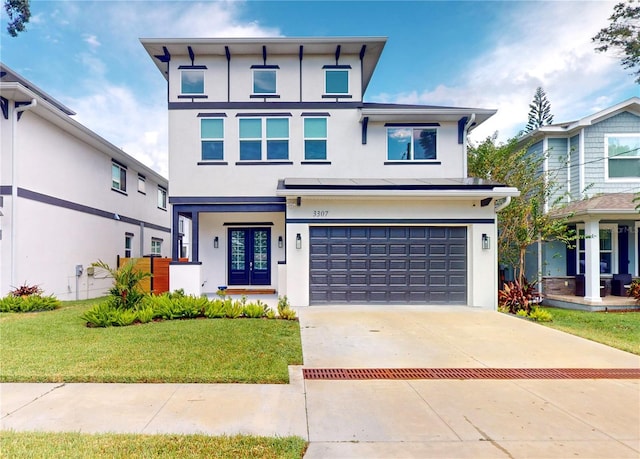 view of front of house featuring a front yard and a garage