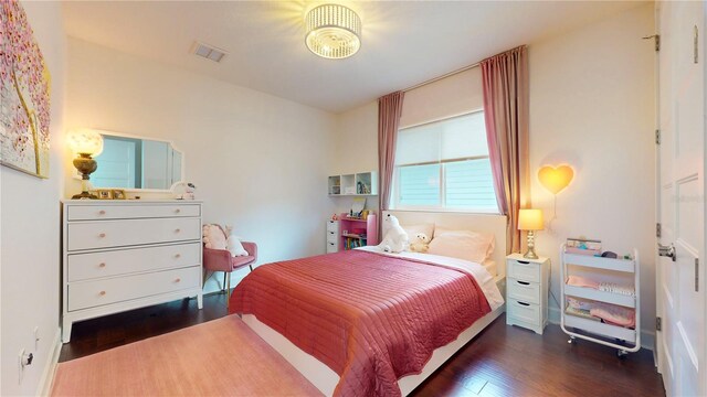 bedroom featuring dark wood-type flooring