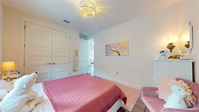 bedroom featuring a closet and hardwood / wood-style floors