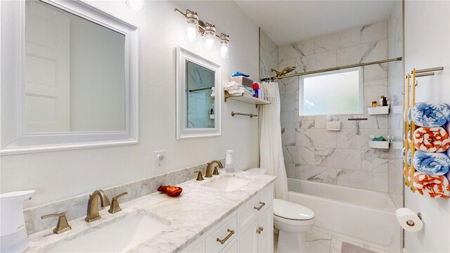 full bathroom with vanity, toilet, and shower / bath combo