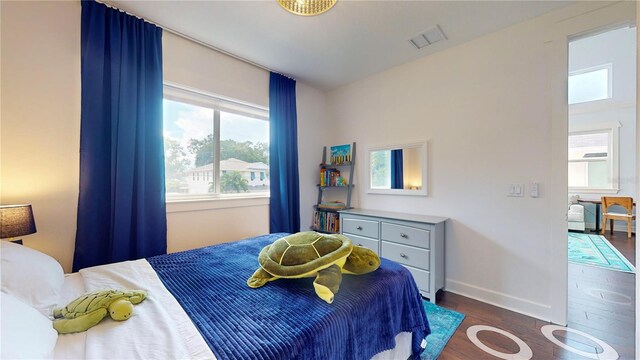 bedroom featuring dark wood-type flooring