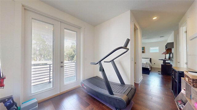 exercise area with french doors and dark hardwood / wood-style flooring