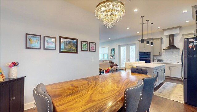 dining room with a chandelier and dark wood-type flooring