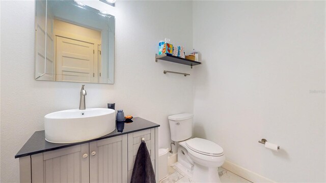 bathroom with toilet and vanity